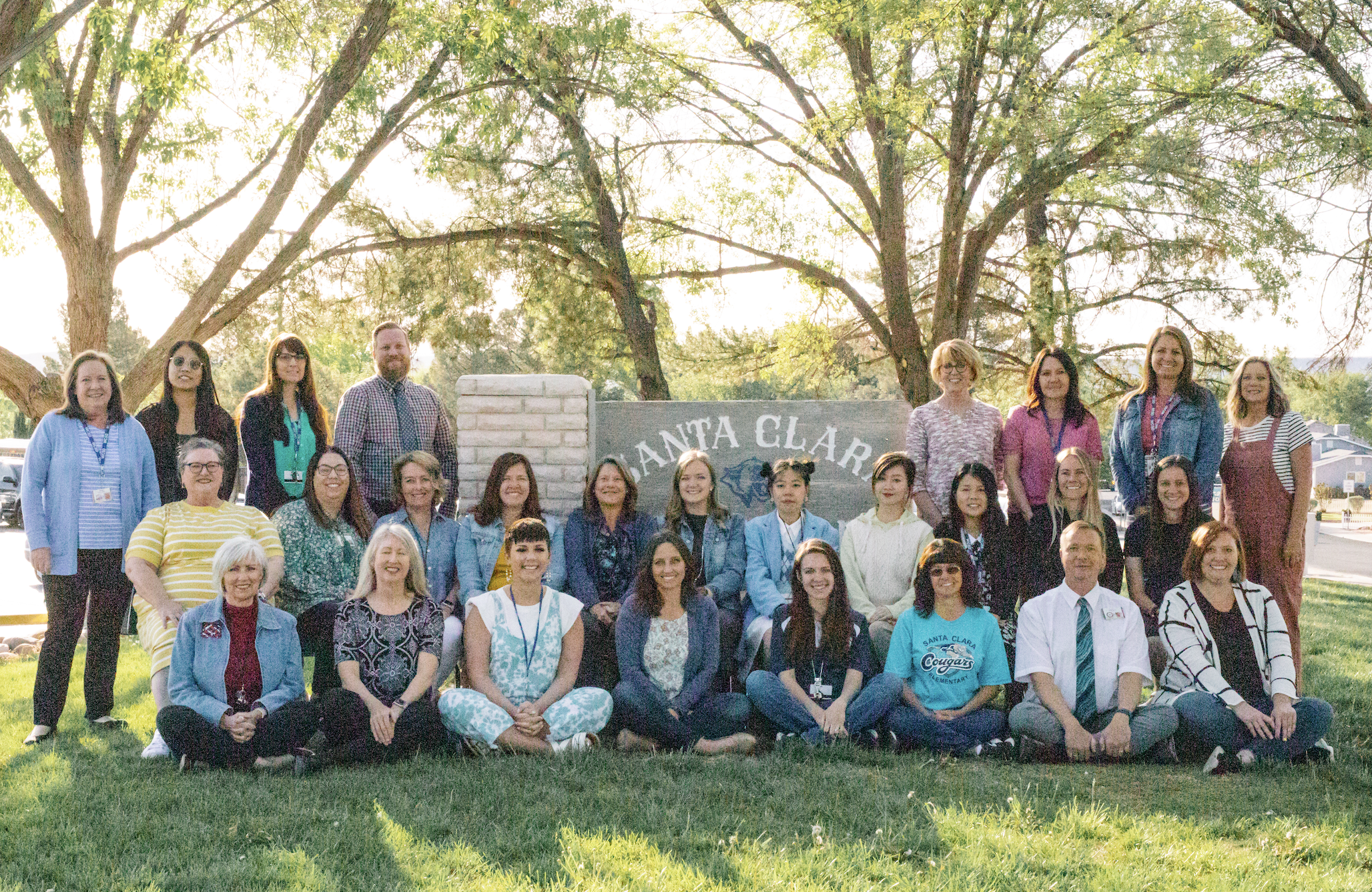 faculty picture with school sign
